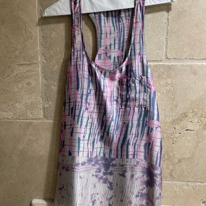 Silly tank top. Feels to incredible to the touch. Size Large